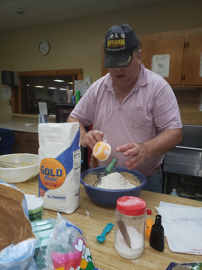 the president cooking in Deridder la for Hurricane Christmas diner